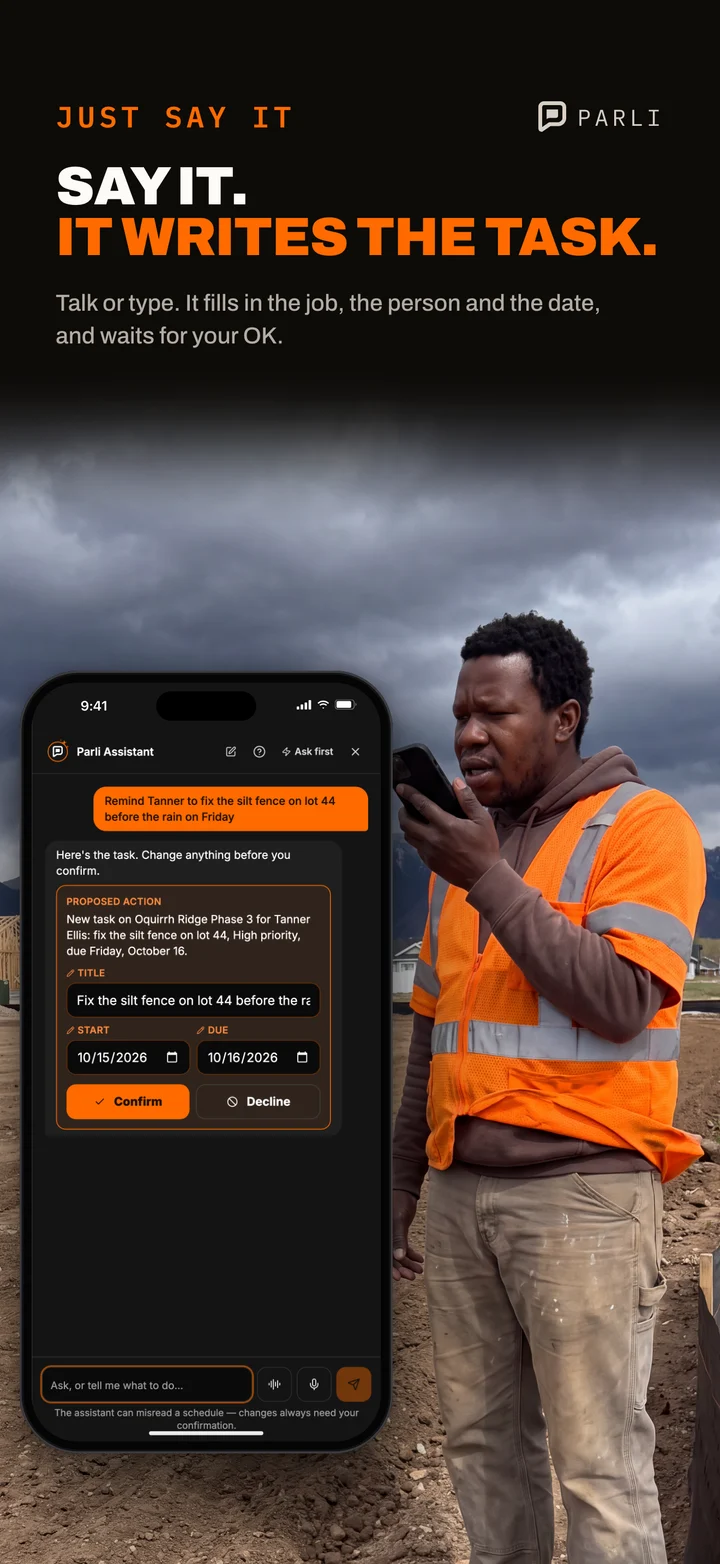 A contractor talks into his phone as storm clouds gather, and the Parli Assistant writes the task